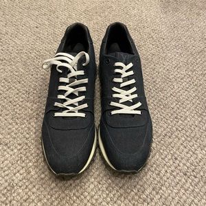 Louis Vuitton dark denim sneakers. Never worn. LV size 10 1/2 fits us 11 1/2